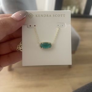 Kendra Scott gold and aquamarine necklace